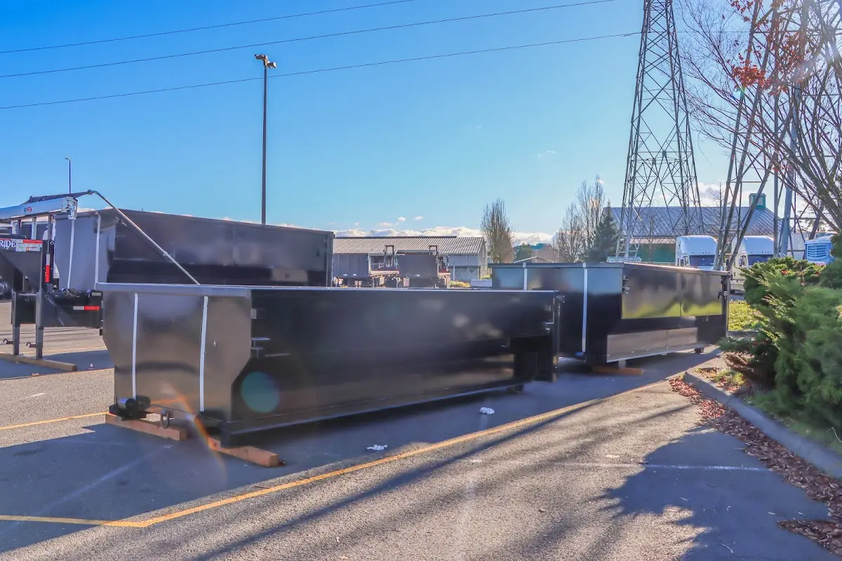 Roll-off dumpster ready for waste disposal at job site for 2 Yard Dumpster Rental in Oxford